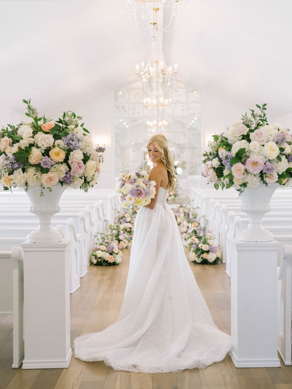 Romantic floral aisle decor with blush roses and lavender hydrangeas in Dallas wedding chapel