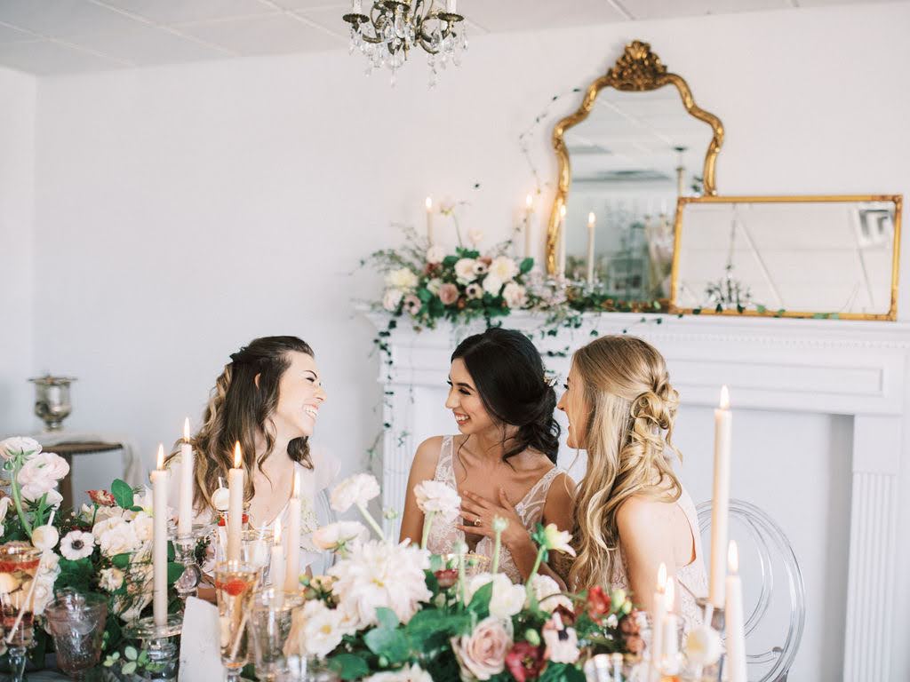 Bride-to-be surrounded by soft pastel florals and curated garden-inspired décor inside the Vella Nest Floral studio in Dallas.
